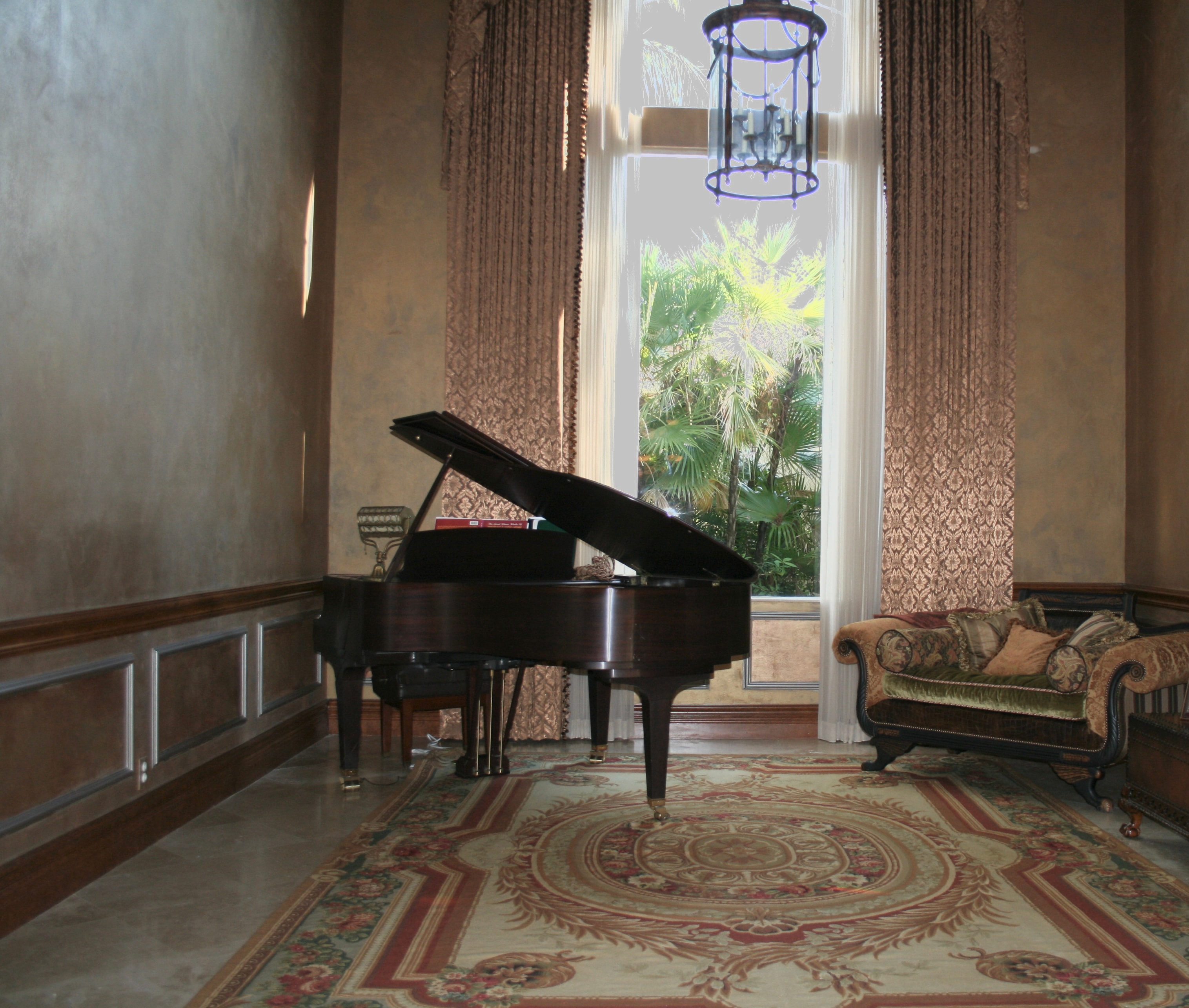 Elegant music room with grand piano, Venetian plaster walls, and tall draped windows — Boca Raton FL