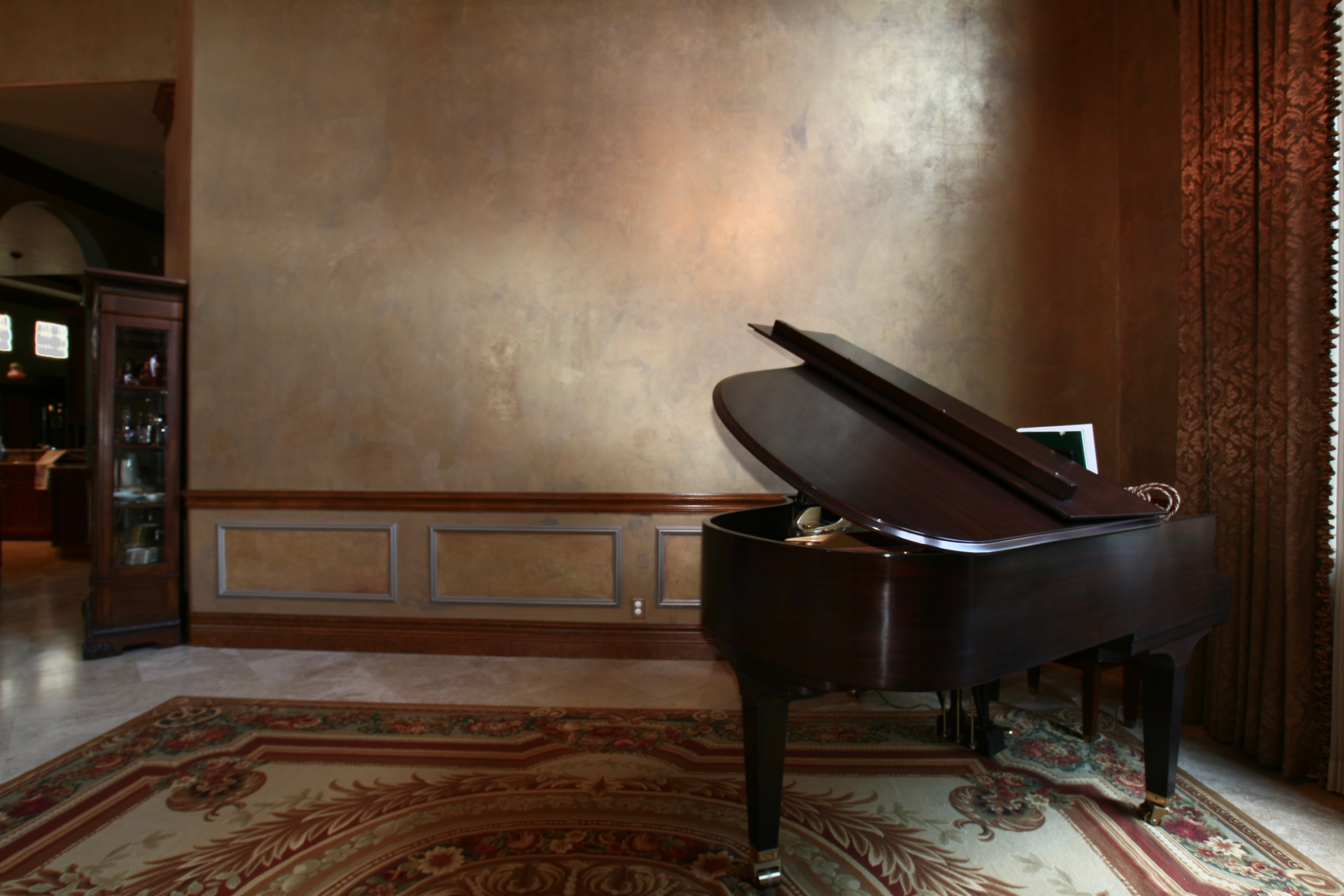 Grand piano room with Venetian plaster accent wall and wainscoting — Boca Raton FL