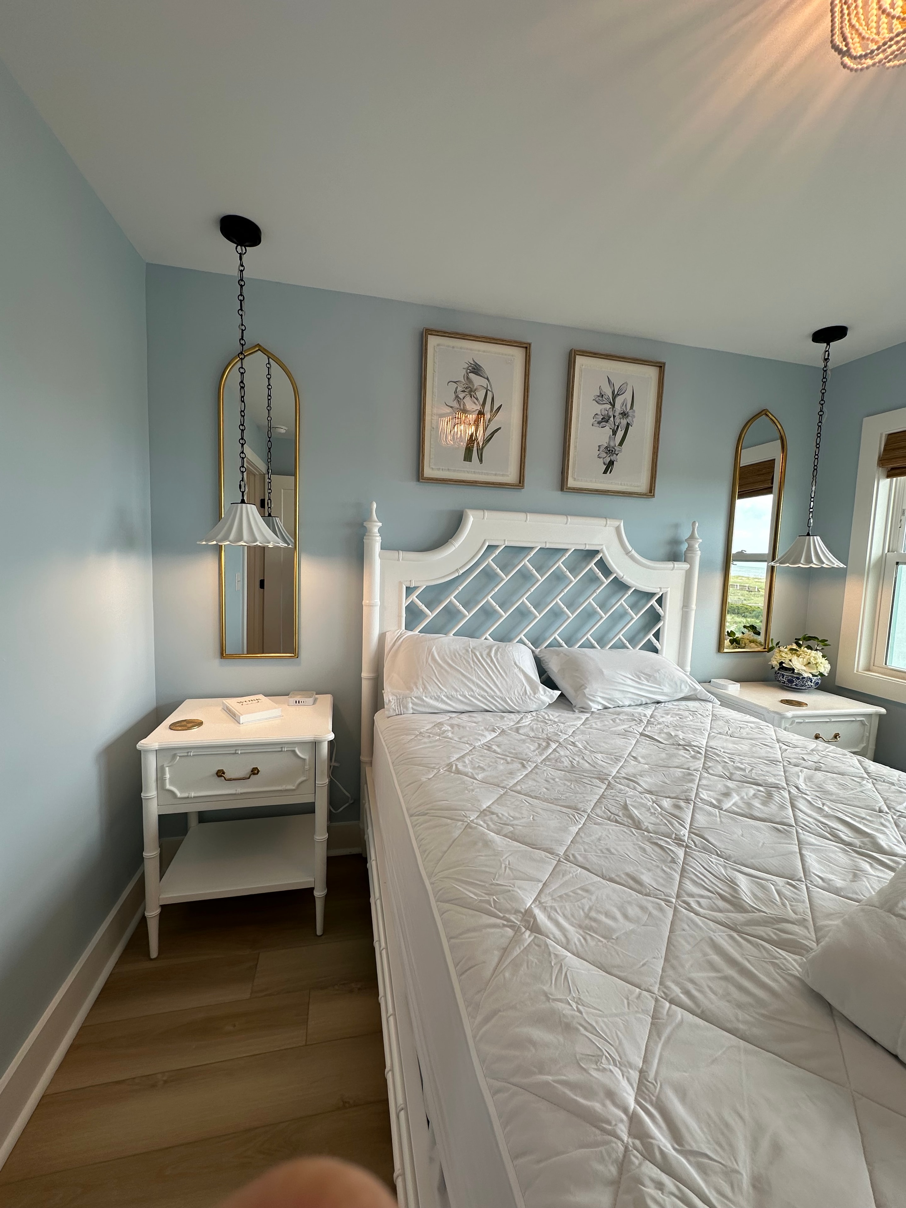 Coastal bedroom with white bed and blue walls — Holden Beach NC