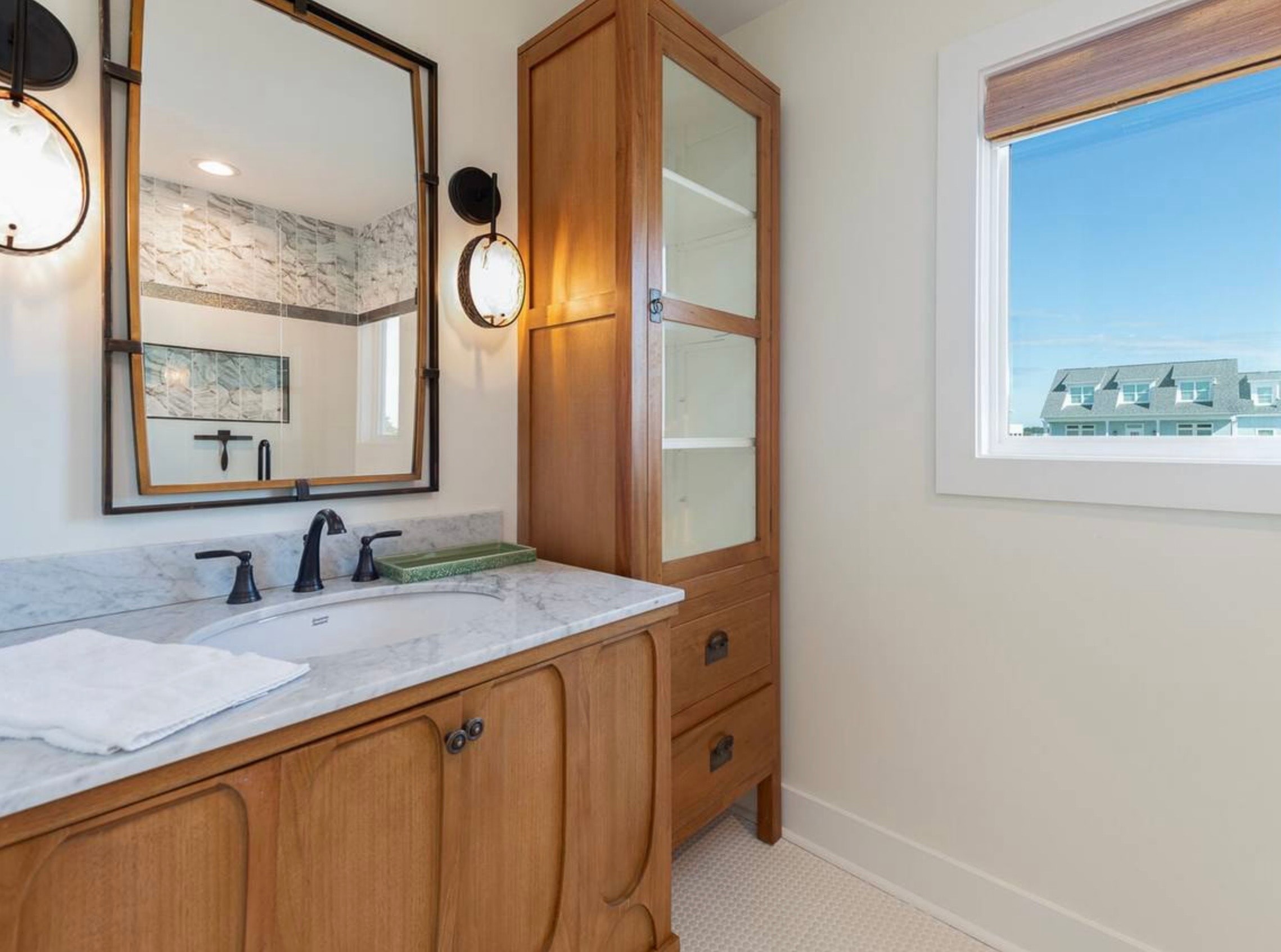 Modern bathroom with wood vanity and marble countertop — Holden Beach NC
