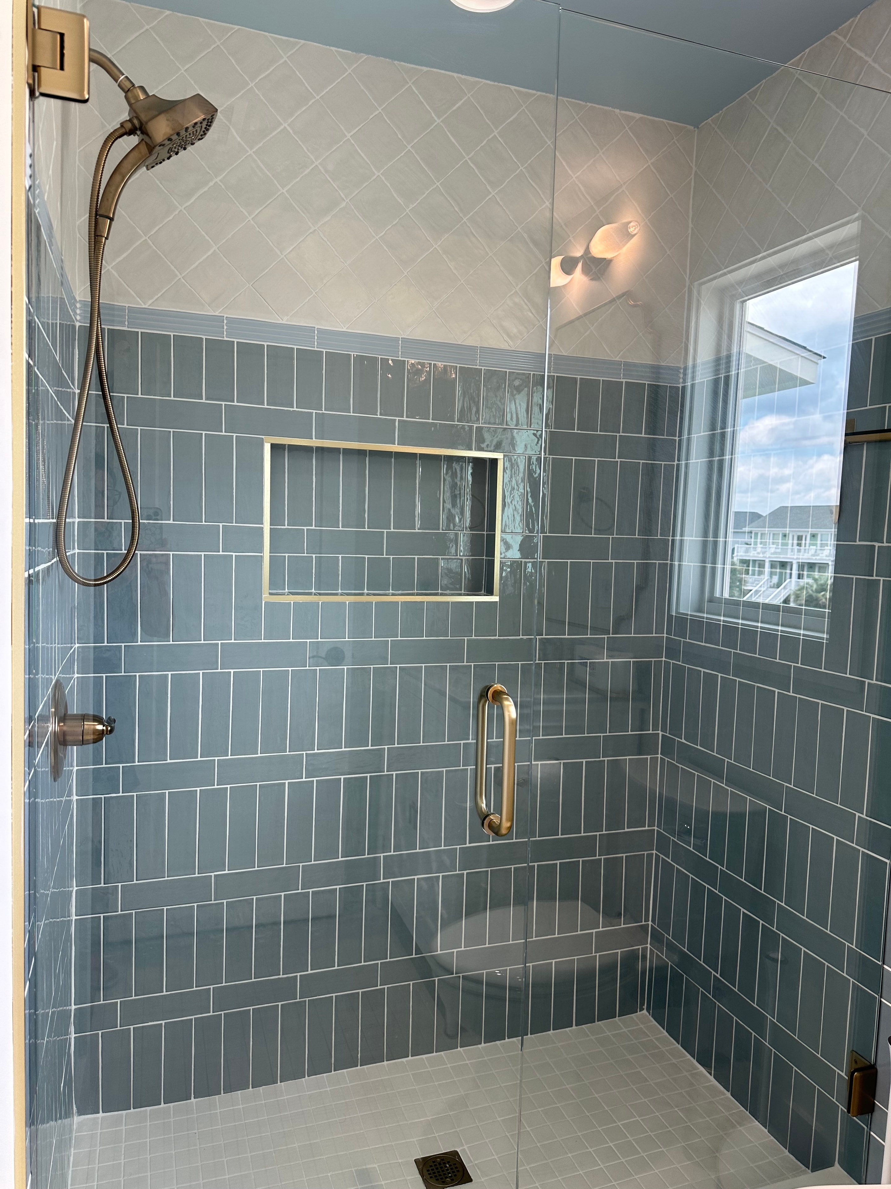 Modern bathroom shower with green tile enclosure — Holden Beach NC