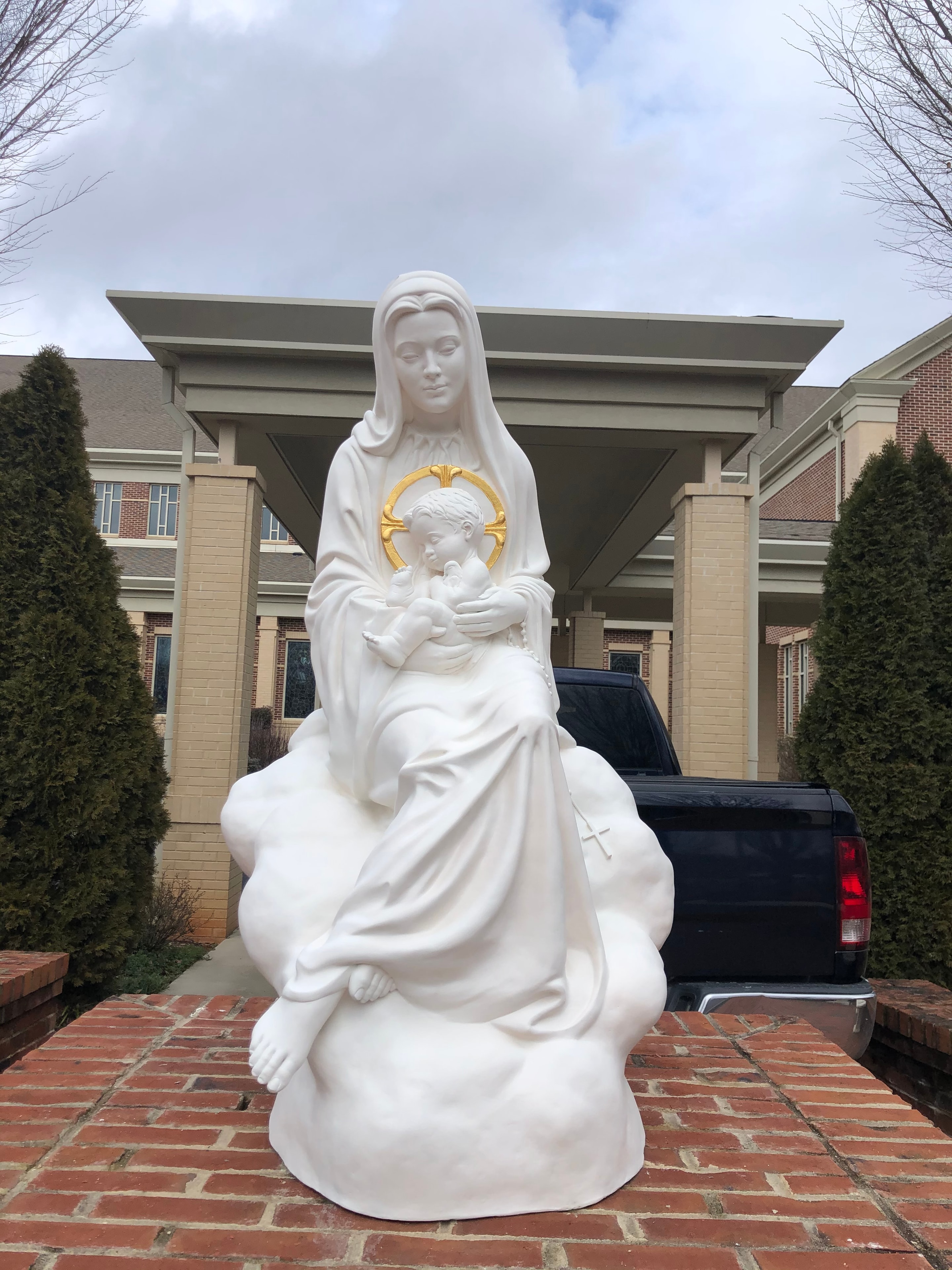 White marble statue of the Madonna and Child at St. Mark Catholic Church