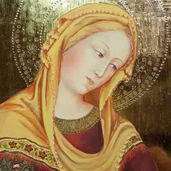 A painting of mary with gold trim and yellow veil.