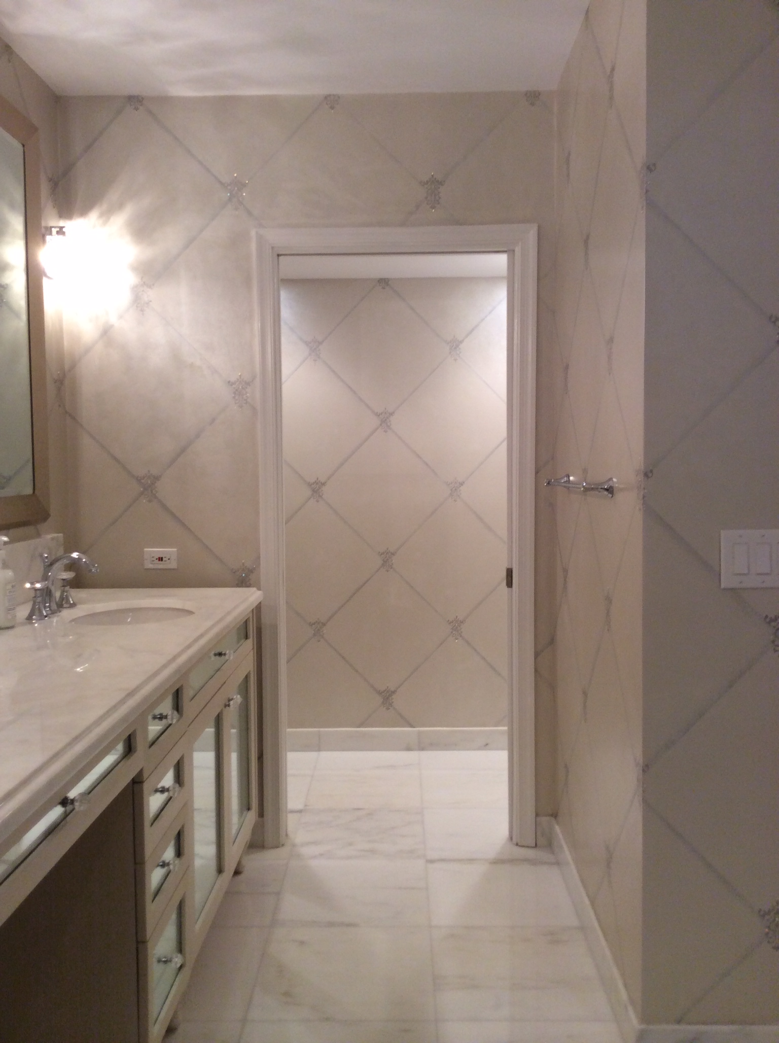 A bathroom with two sinks and a mirror.