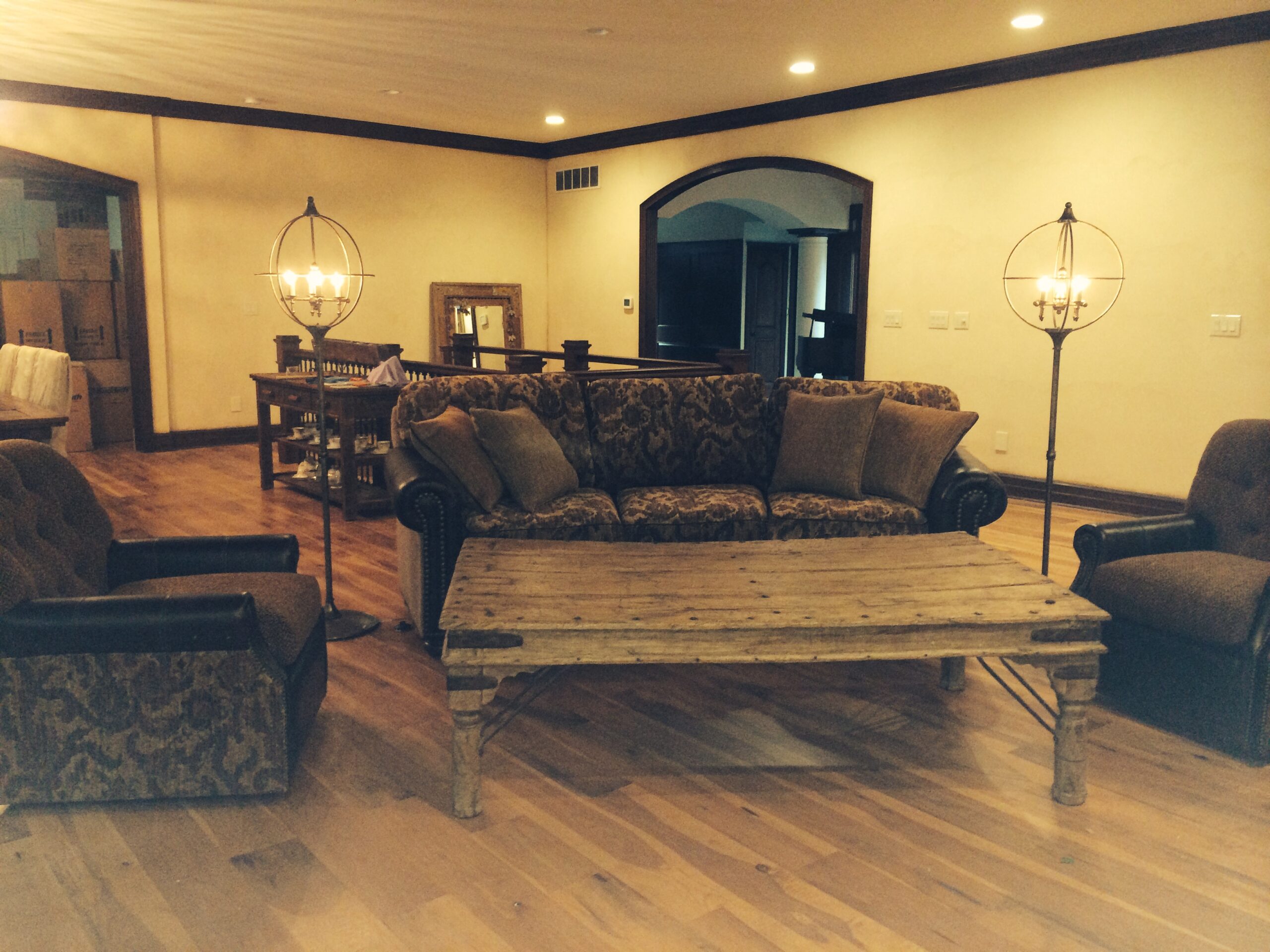 A living room with wooden floors and furniture.