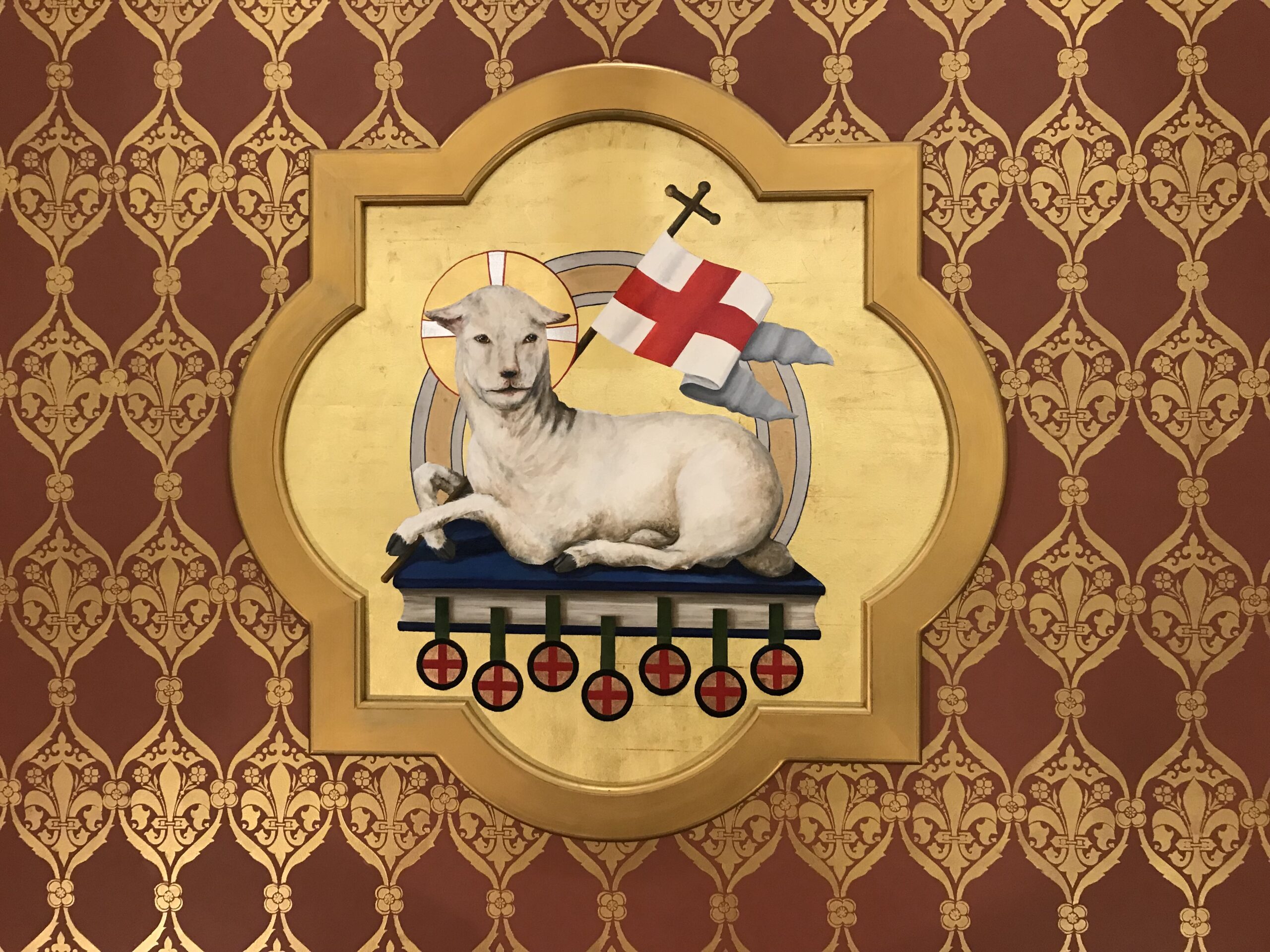 A lamb with a cross on it's back.