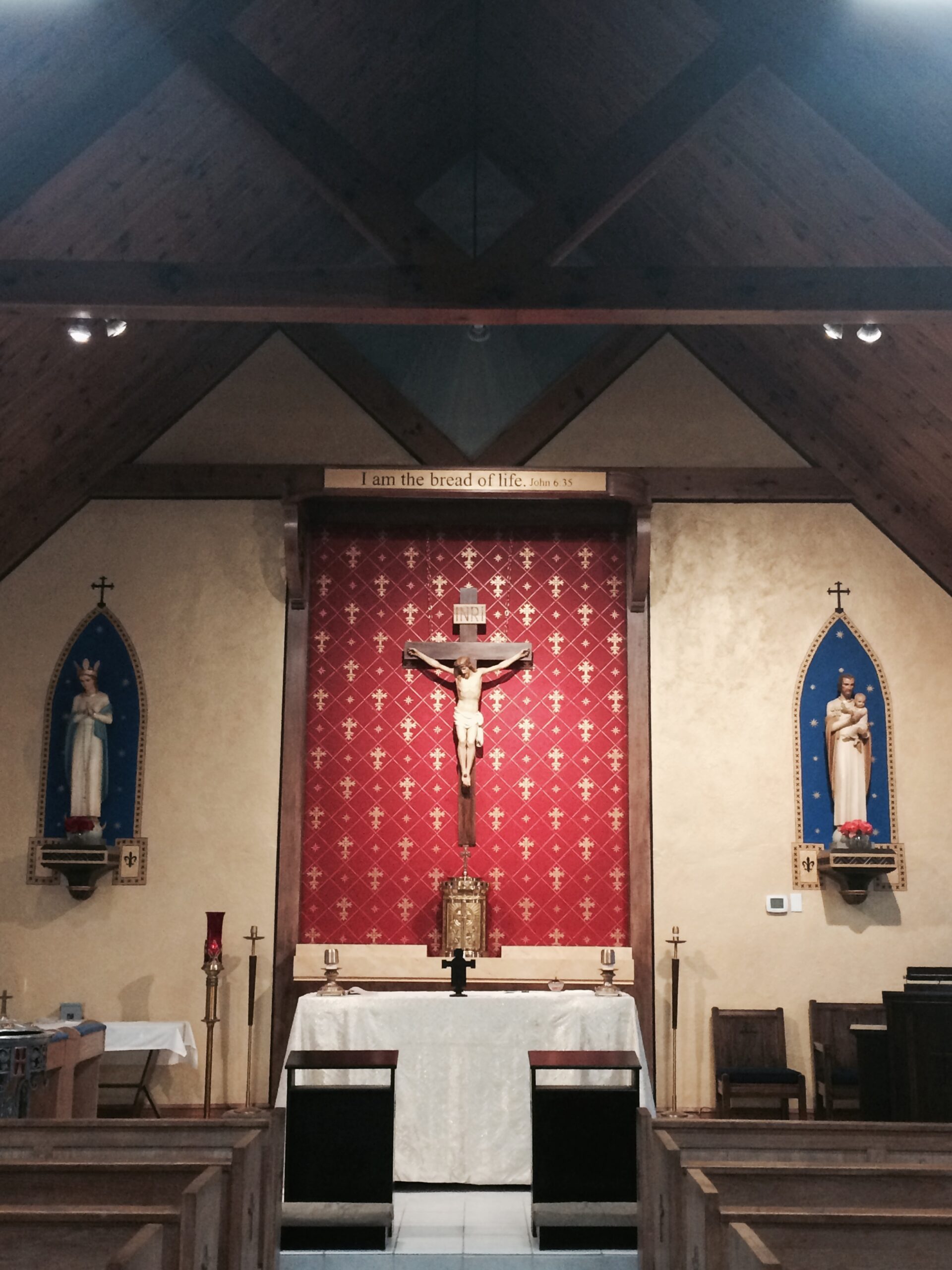 A church with two large crucifixes and a cross.