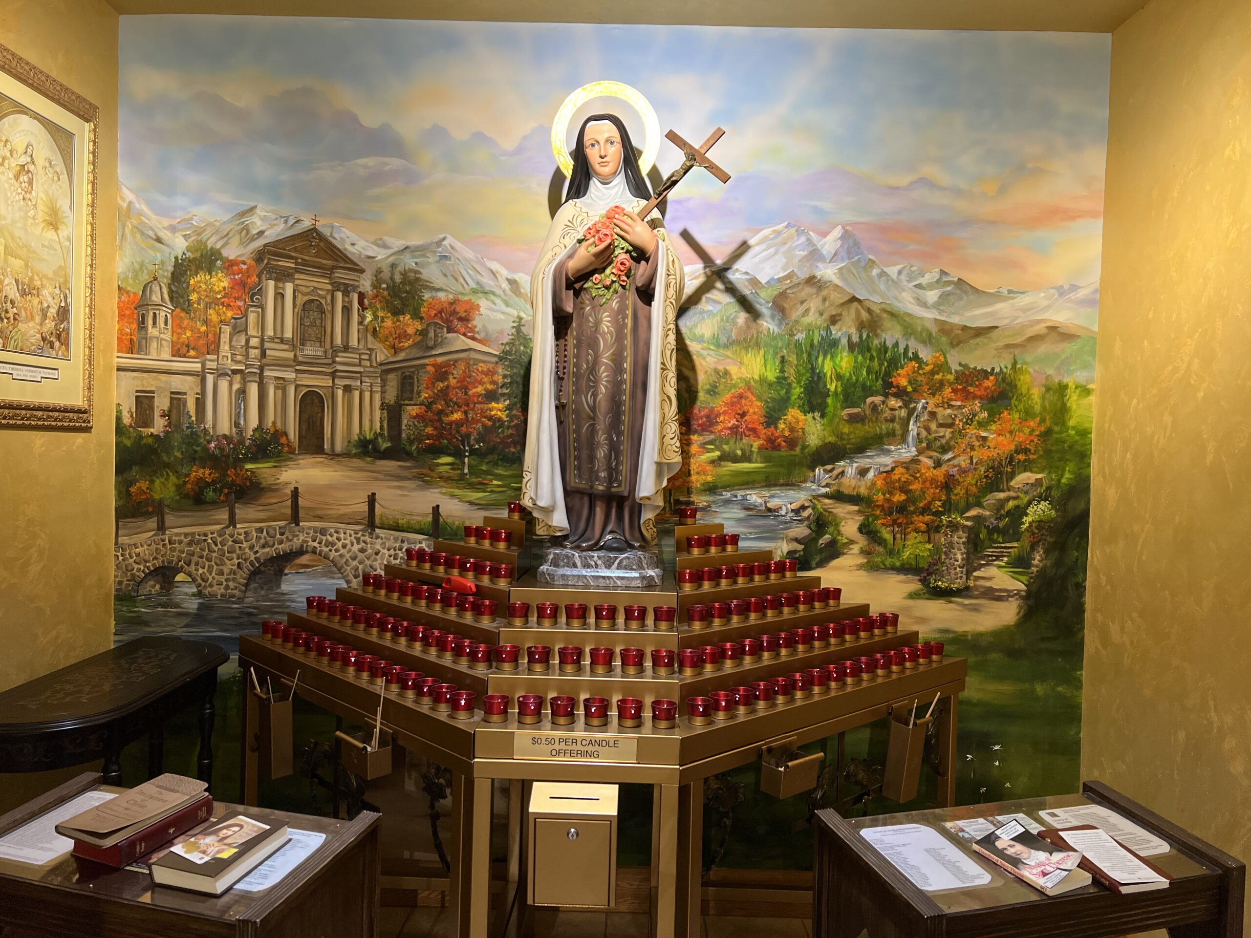 A large mural of jesus and the cross on the wall.