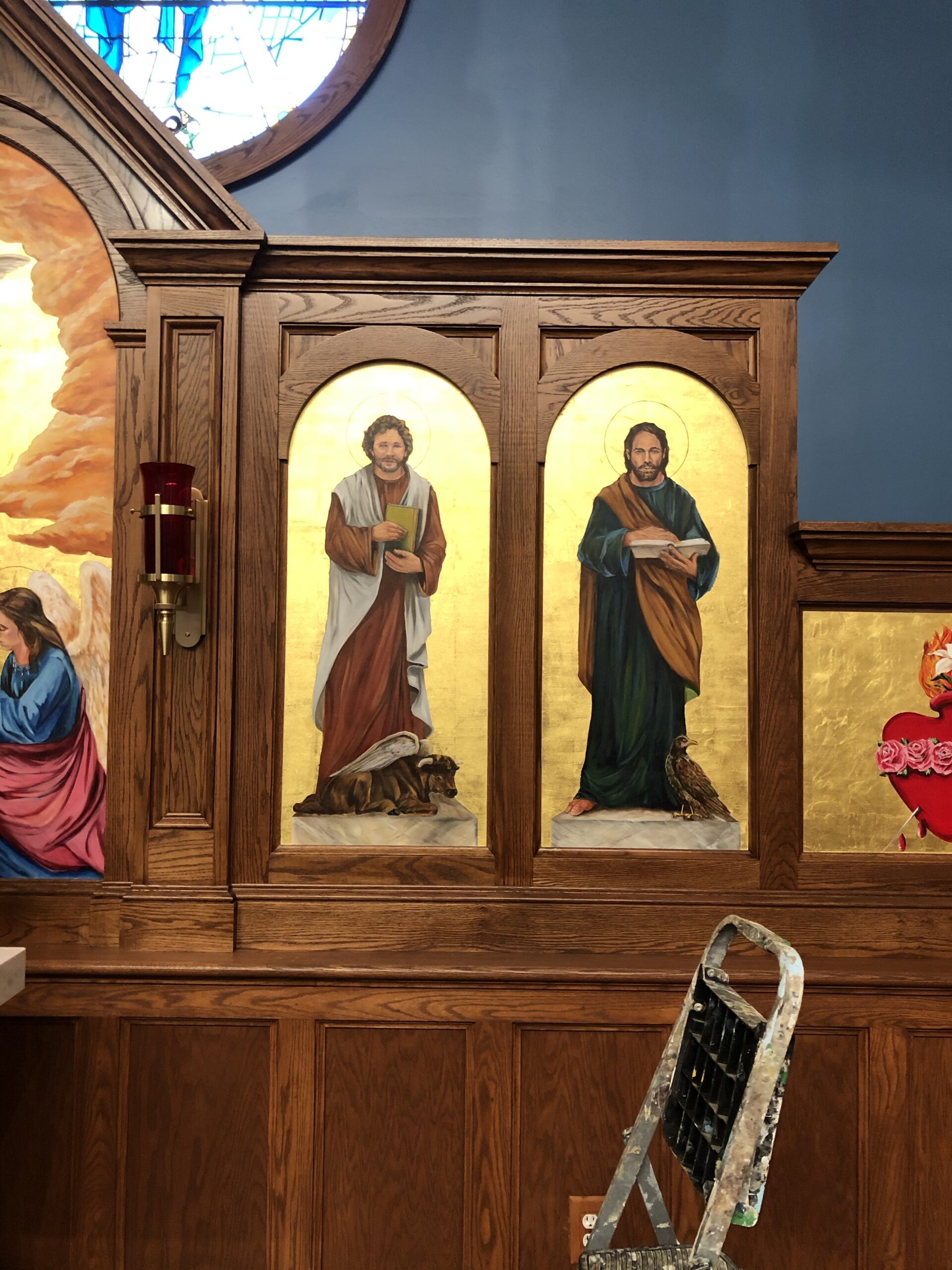 A painting of jesus and mary in the center.