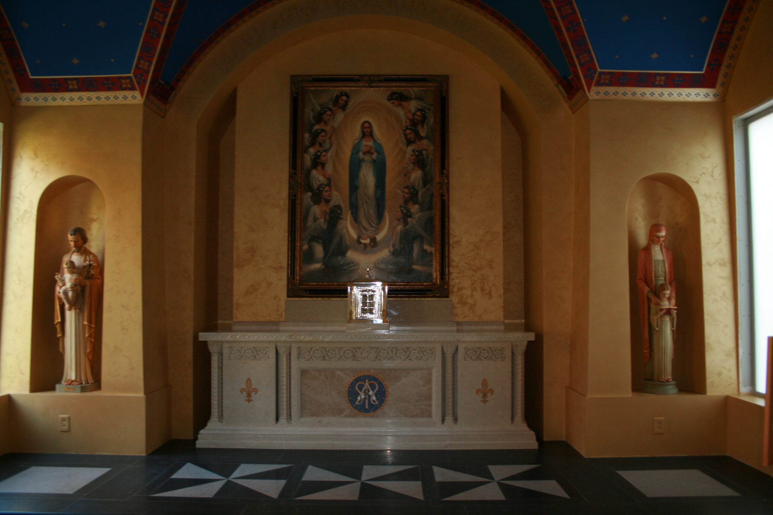 A large painting of the virgin mary on the wall.